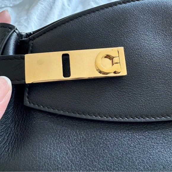 Ferragamo Hug Pouch bag in black and gold hardware - Picture 6 of 11